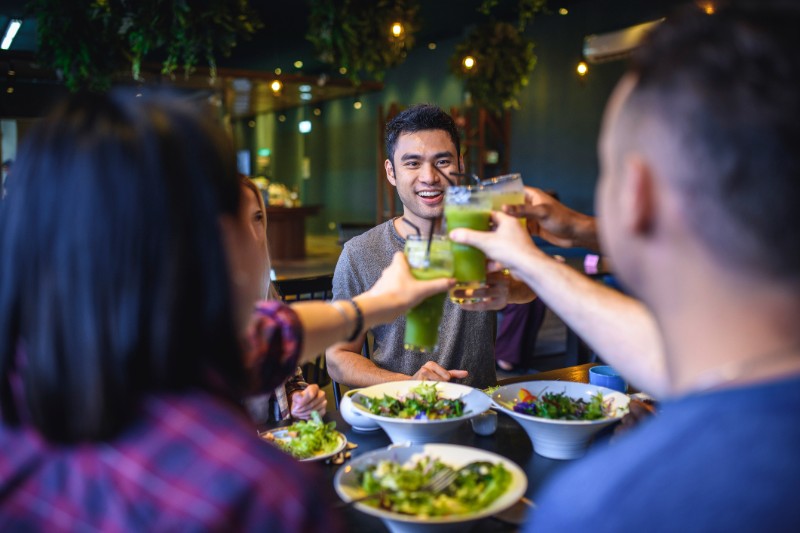 group of friends eating green