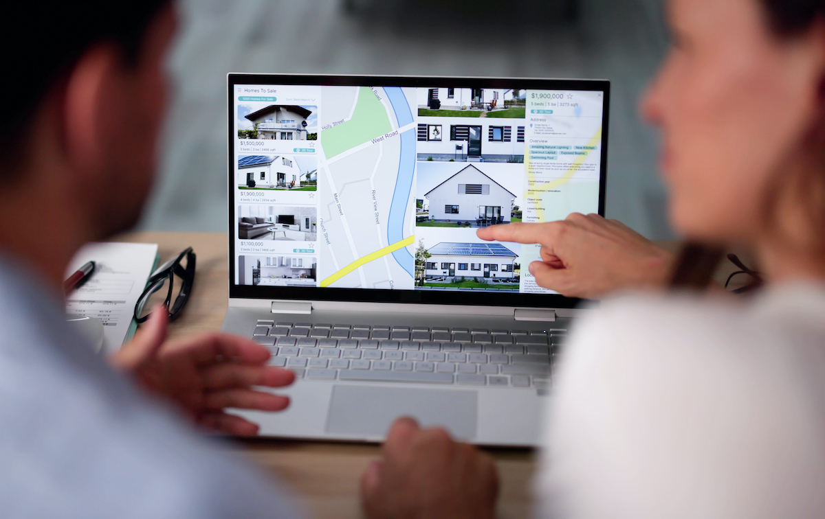 Couple Family Searching Real Estate Online On Laptop