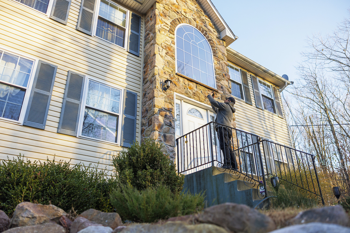 Real estate agent is taking pictures of the house in Pennsylvania, USA.